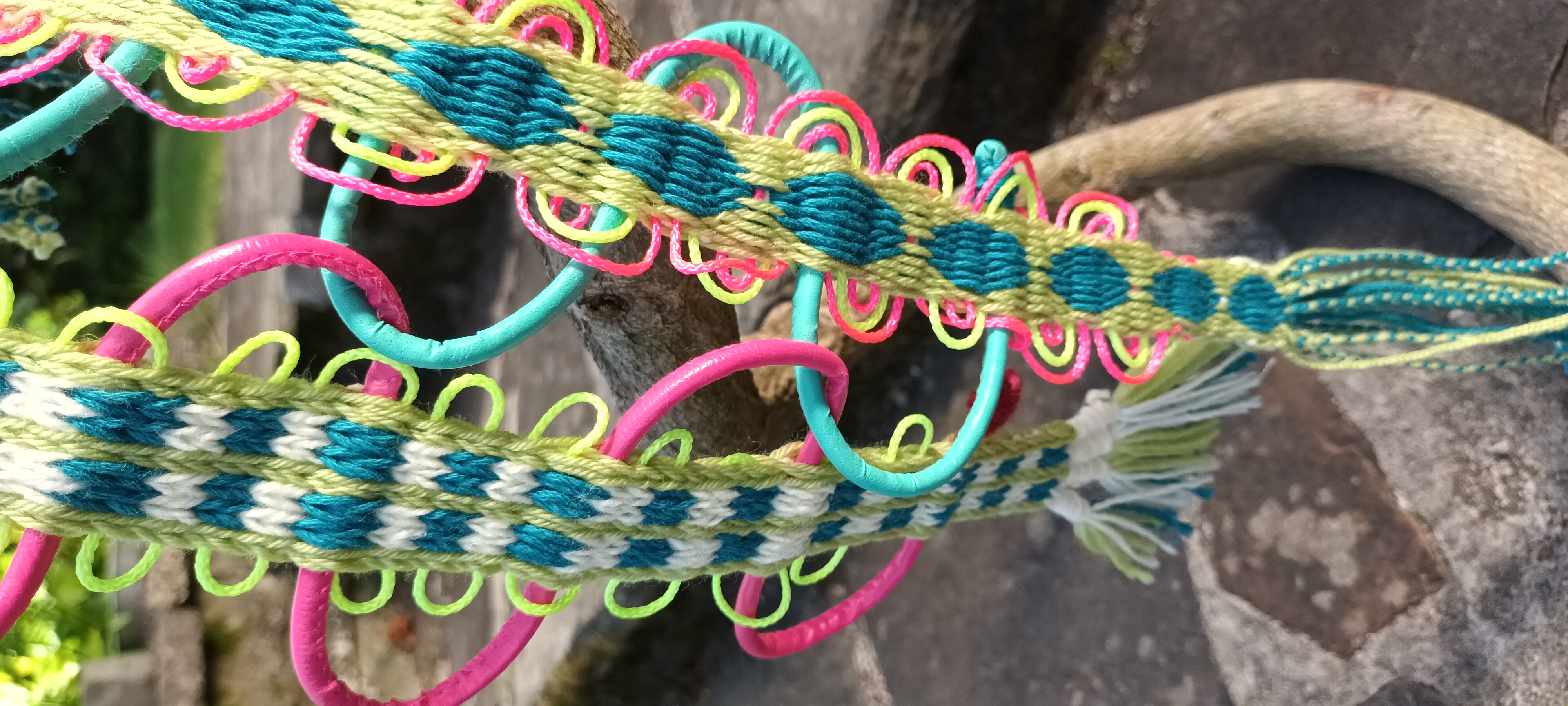 Green, teal, white and pink card woven bands with looped decorative edging