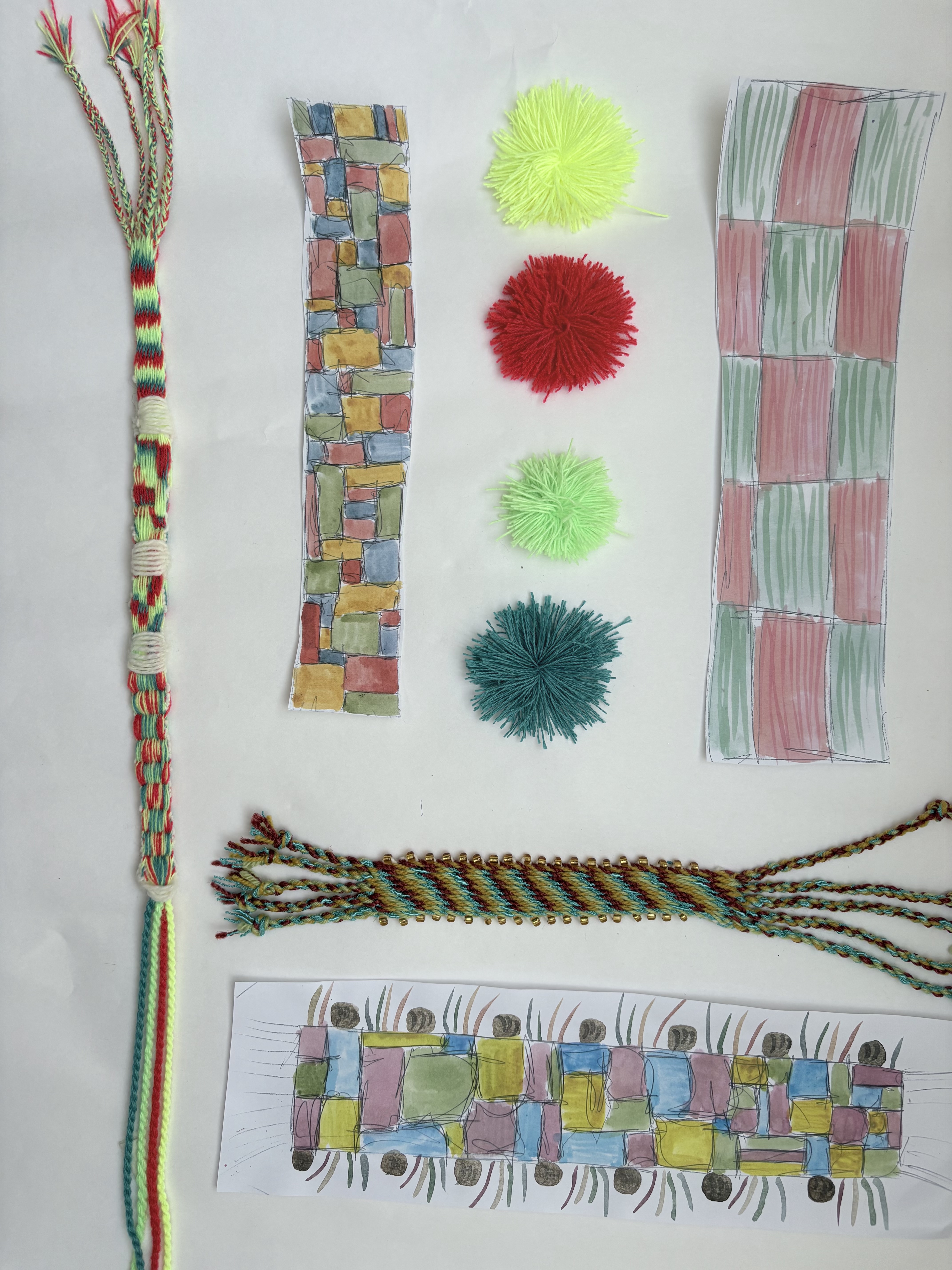 Colourful woven bands with pom poms, beaded edging and painted pattern planning sheets